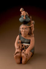 "Making Babies for Indian Market" by Roxanne Swentzell of Santa Clara Pueblo. This piece was featured on the 2004 Official Santa Fe Indian MarketÂ®Â® poster. Photo by Wendy McEahern.